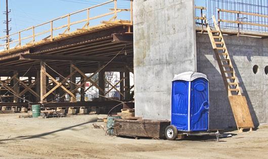 work site necessities a group of porta potties ready for use by the crew