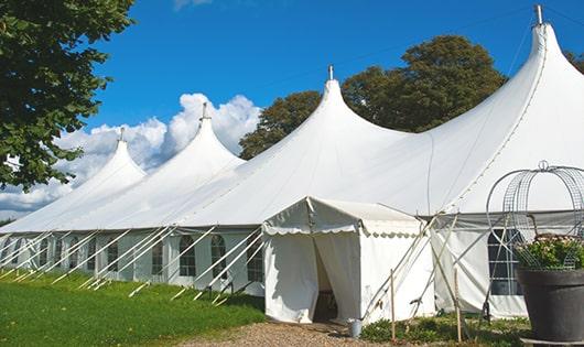 high-quality portable toilets stationed at a wedding, meeting the needs of guests throughout the outdoor reception in Troy